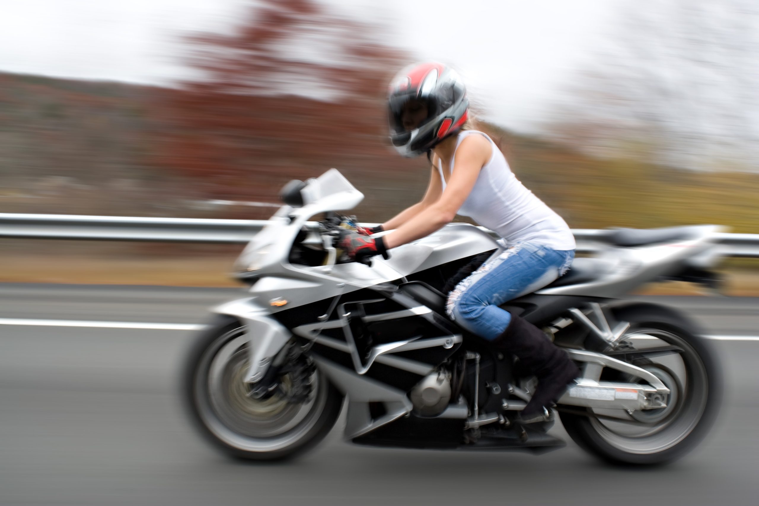 abstract blur of a pretty girl driving a motorcycle at highway speeds intentional motion blur St0ZXaOAHo scaled